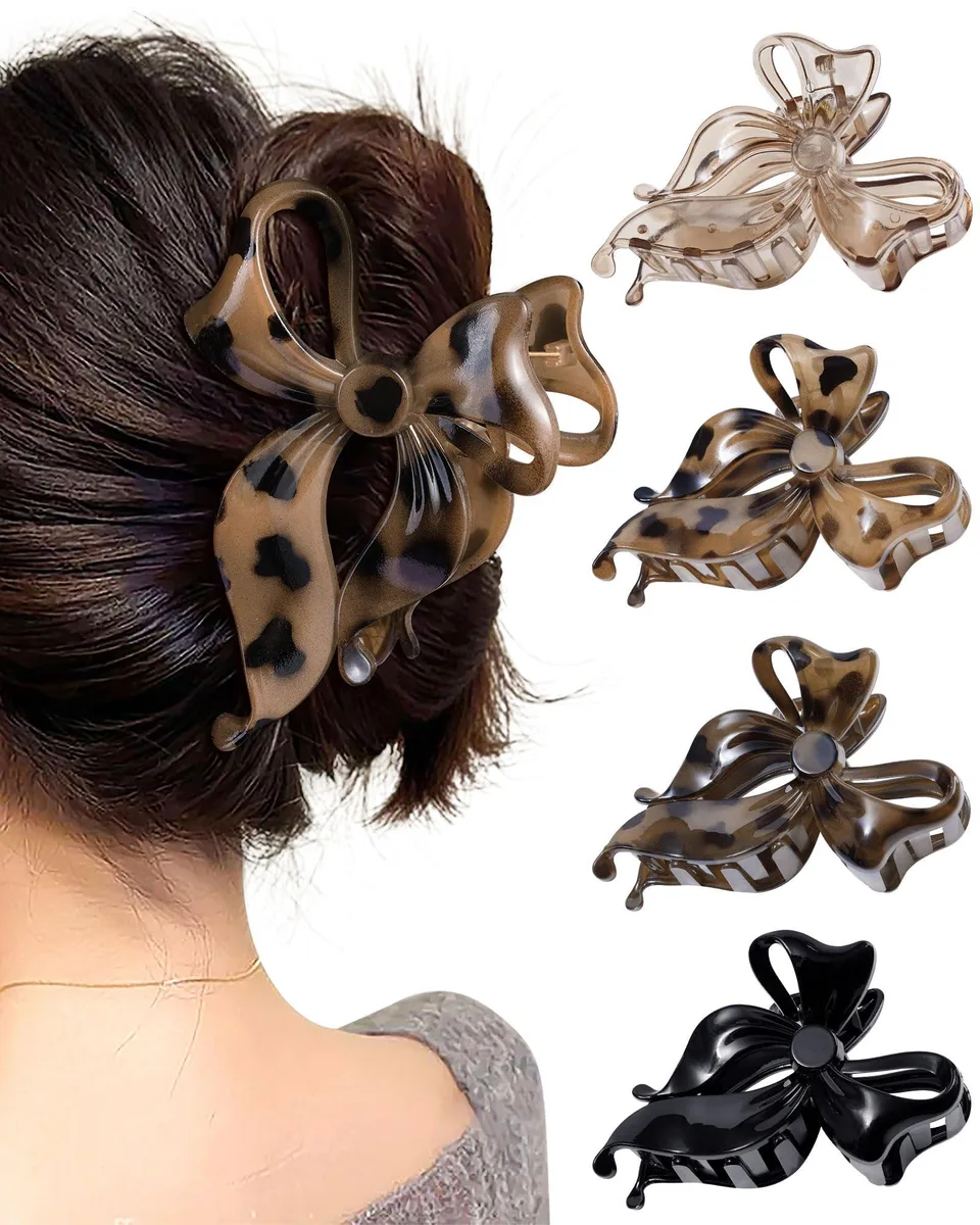 Four matte plastic bow claw clips in animal print colours