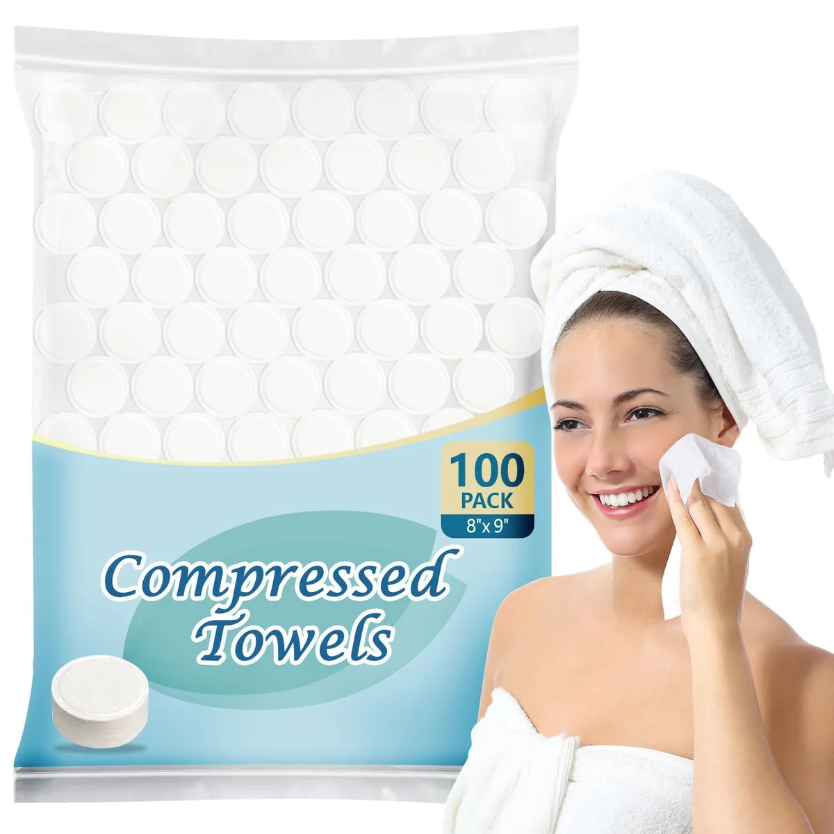 A box of 100 coin-sized compressed towel tablets, white viscose fibre, travel pack