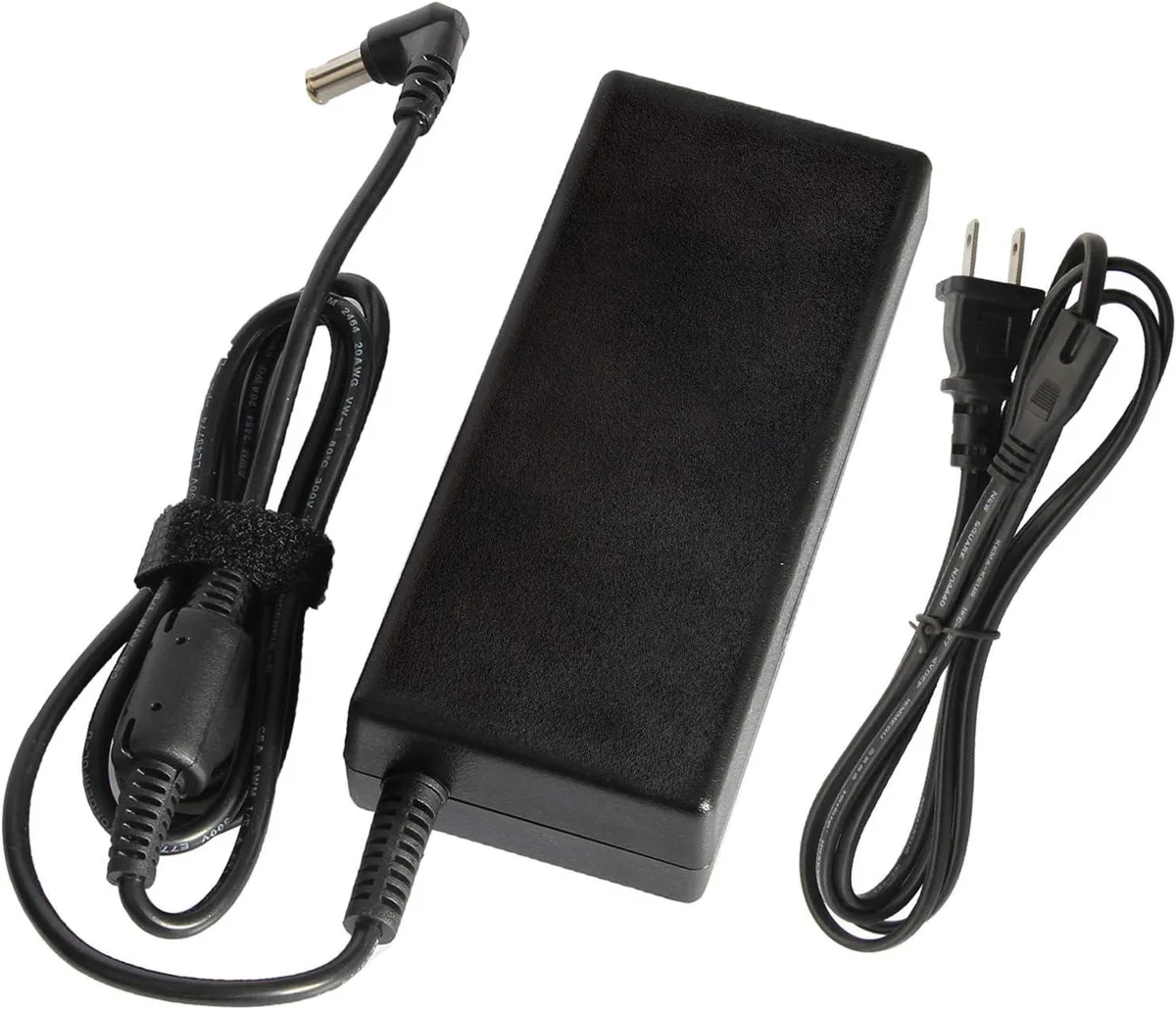 Black rectangular AC adapter with 6.5 by 4.4 mm barrel connector and detachable power cord