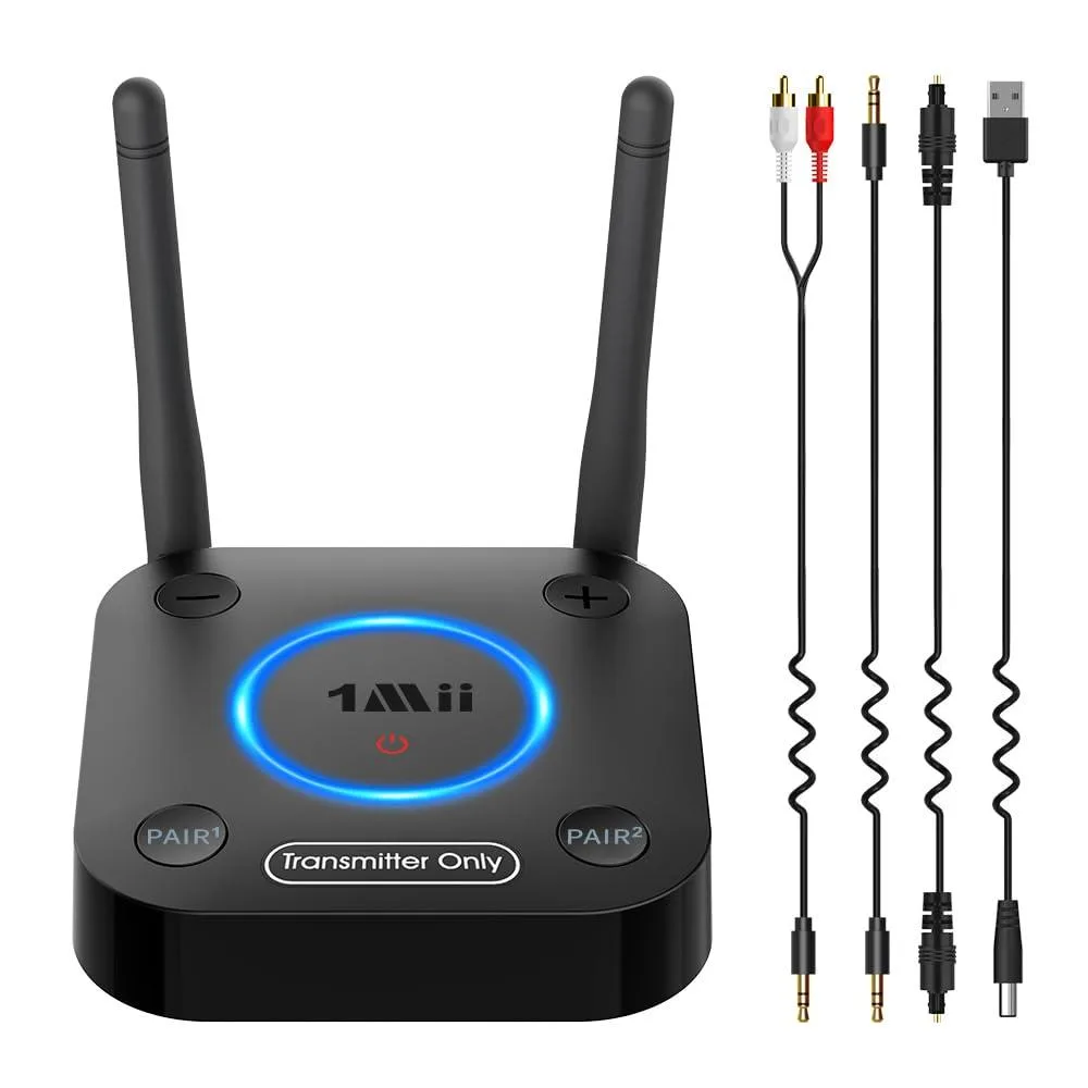 Small black rectangular box with front volume knob and multiple rear audio ports