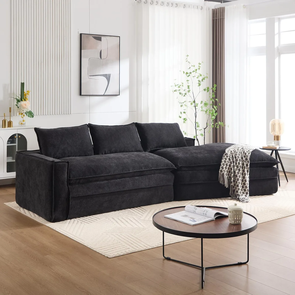 Black modular sectional sofa with right-facing chaise, fabric upholstery