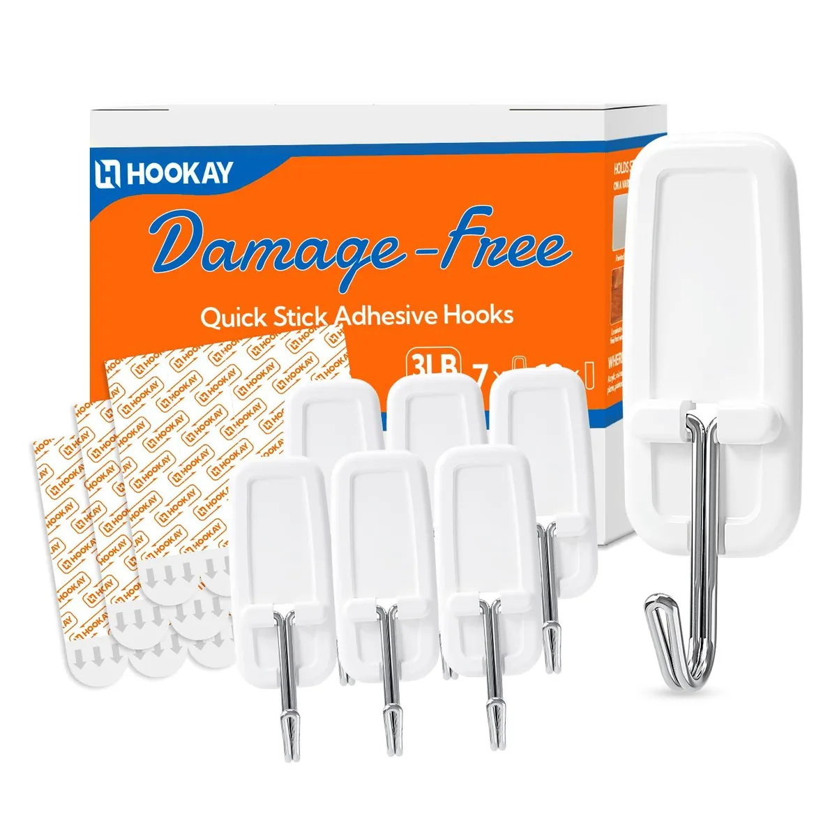 Seven white wire toggle hooks and twelve adhesive strips on a light background
