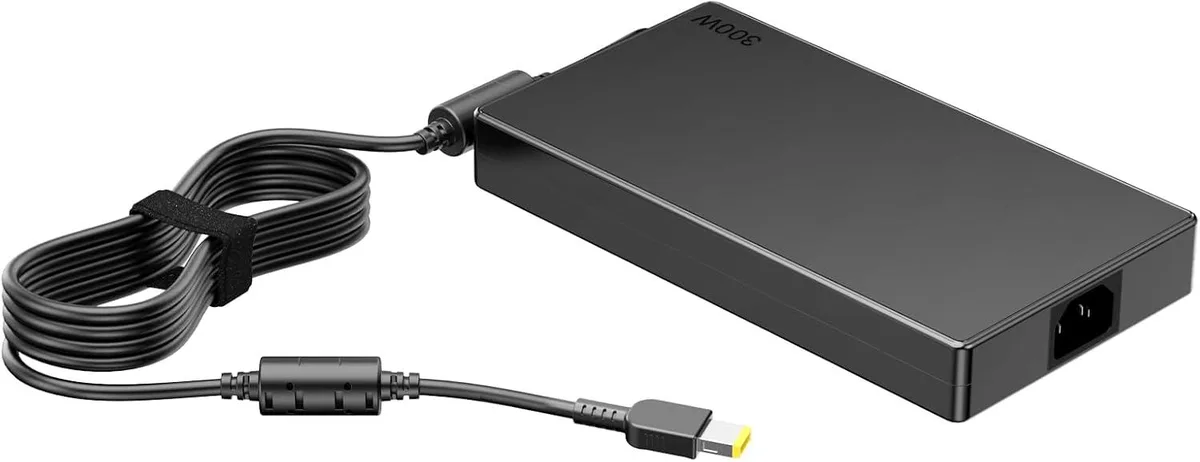 Black rectangular laptop charger with detachable power cord