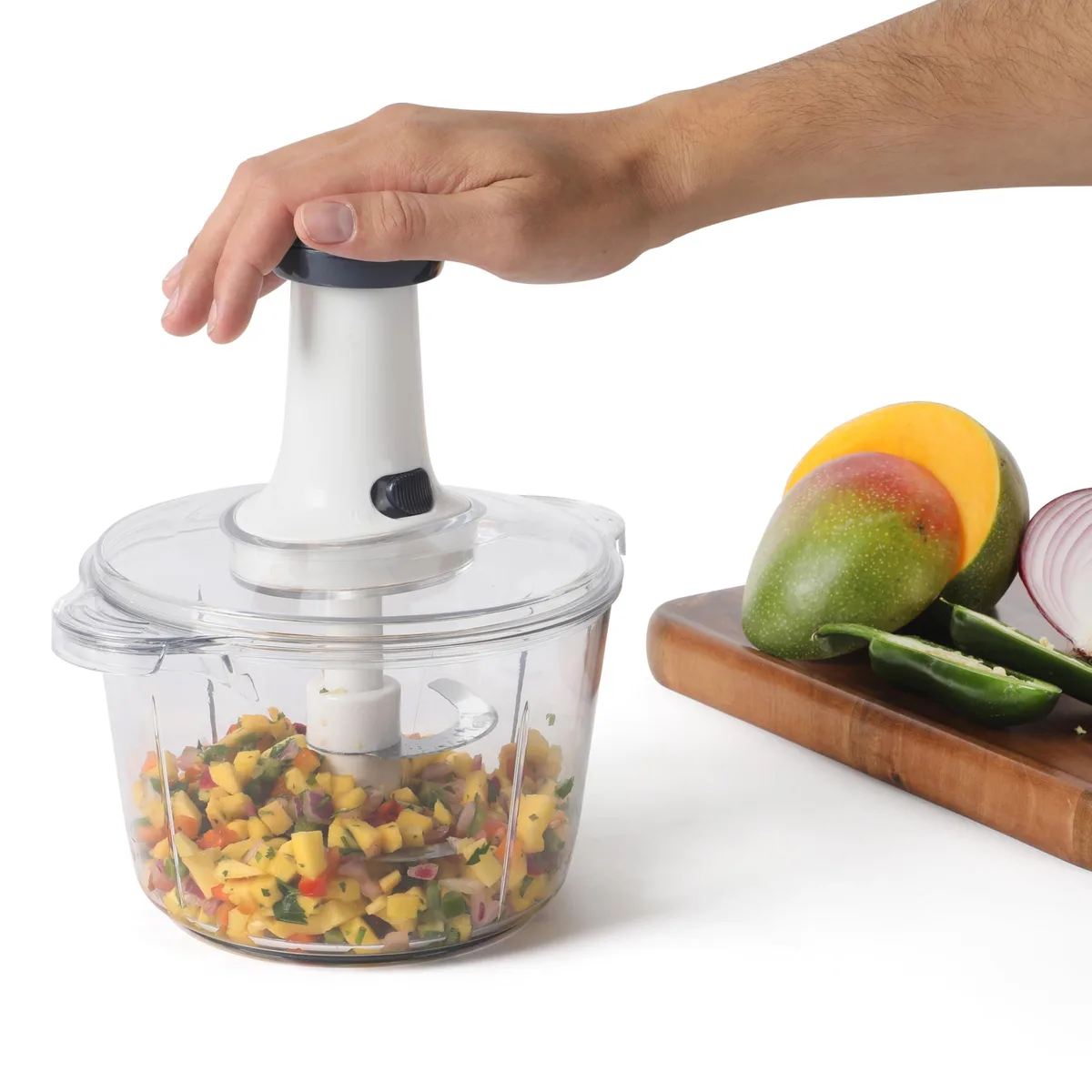 White manual food chopper with clear bowl and pump handle