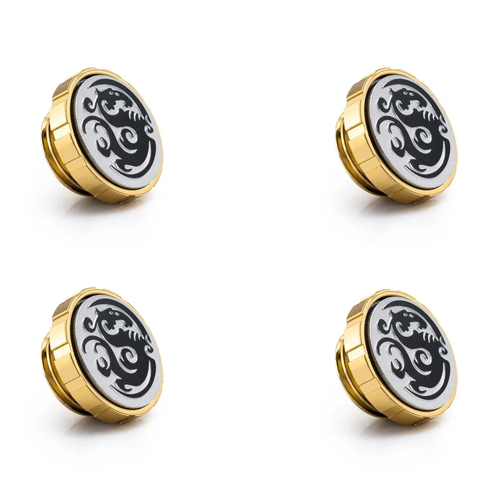 Four brass stop fittings with magnetic logo caps