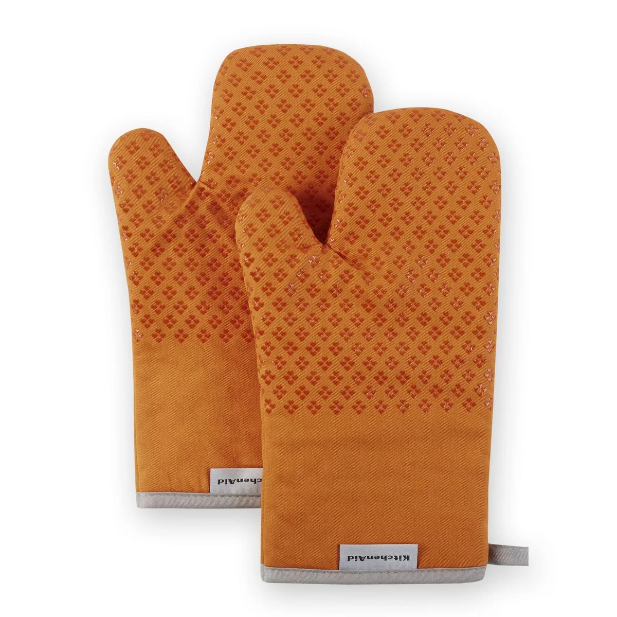Two honey orange oven mitts with heart-shaped silicone grips, 7 by 12.5 inches
