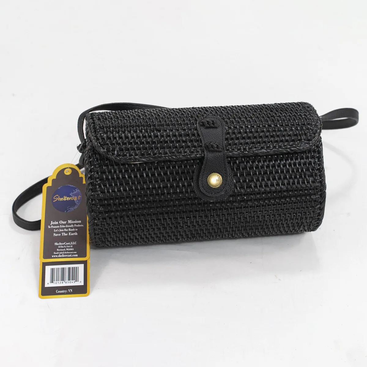 Large black handwoven rattan crossbody bag with bow buckle closure and flax lining