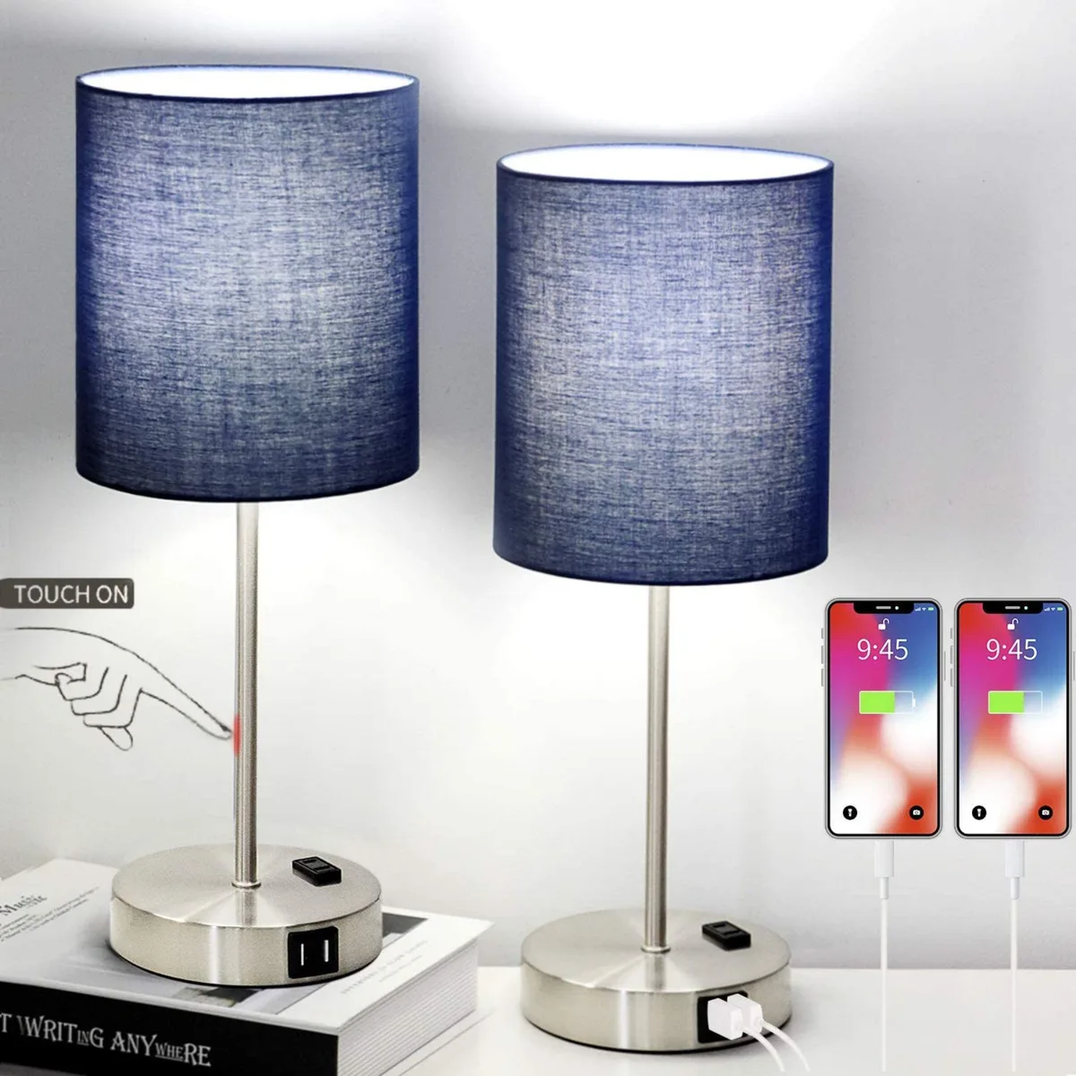 Two blue linen drum shades on silver metal bases with built-in USB ports and AC outlet