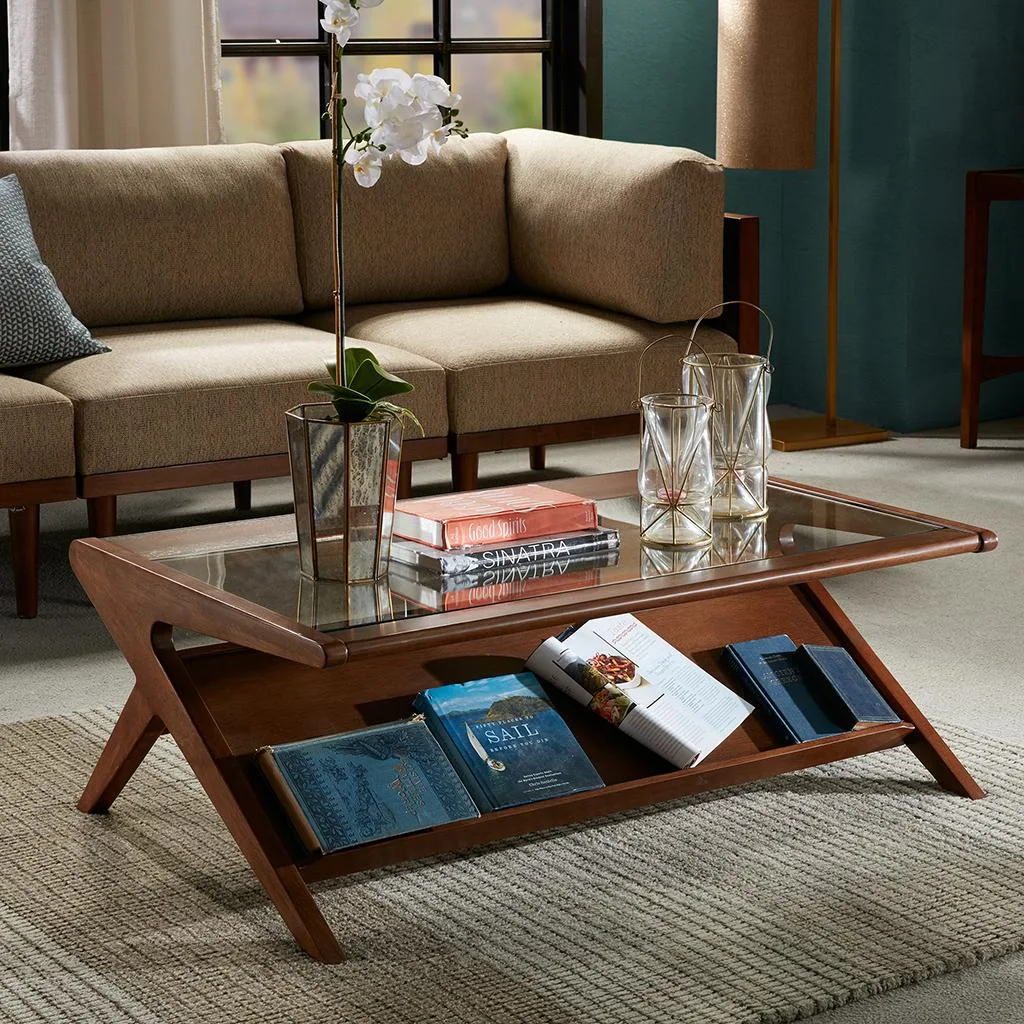 Rectangular walnut coffee table with clear tempered glass top and angular lower shelf