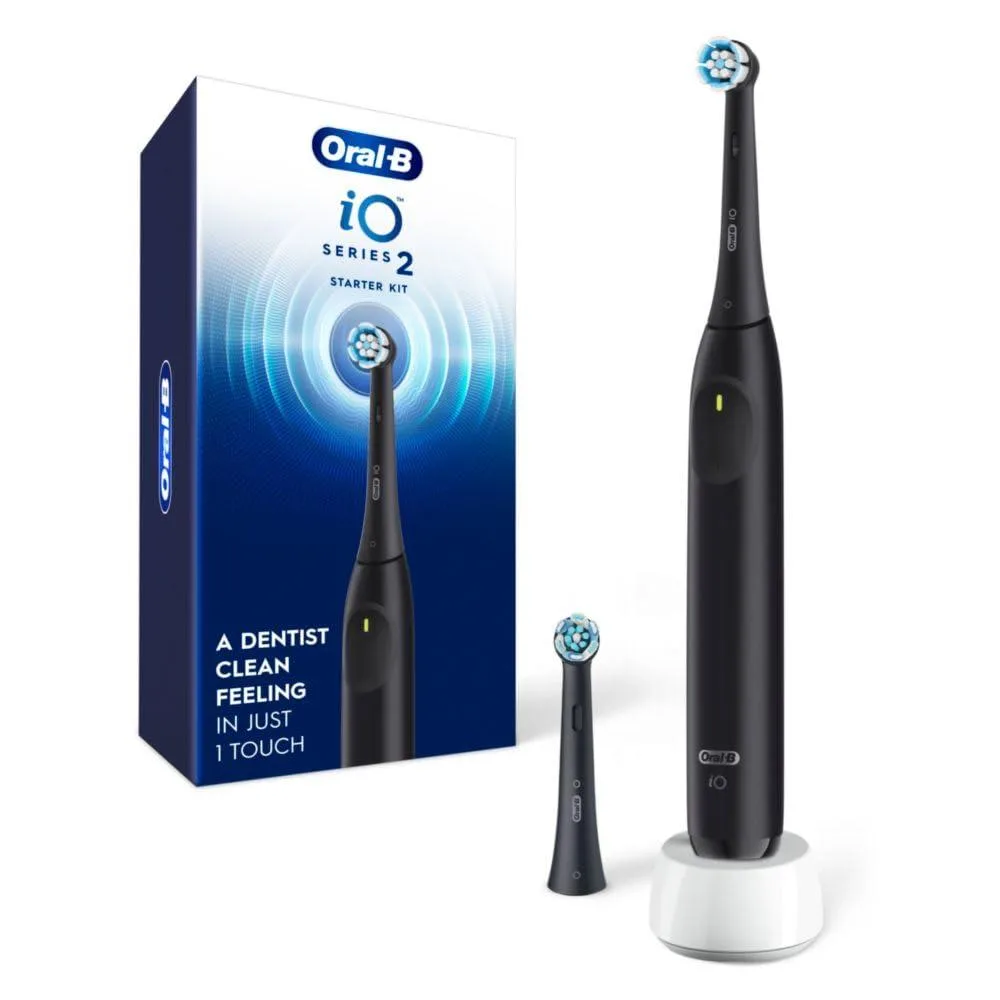 Black rechargeable electric toothbrush with two brush heads and charging base