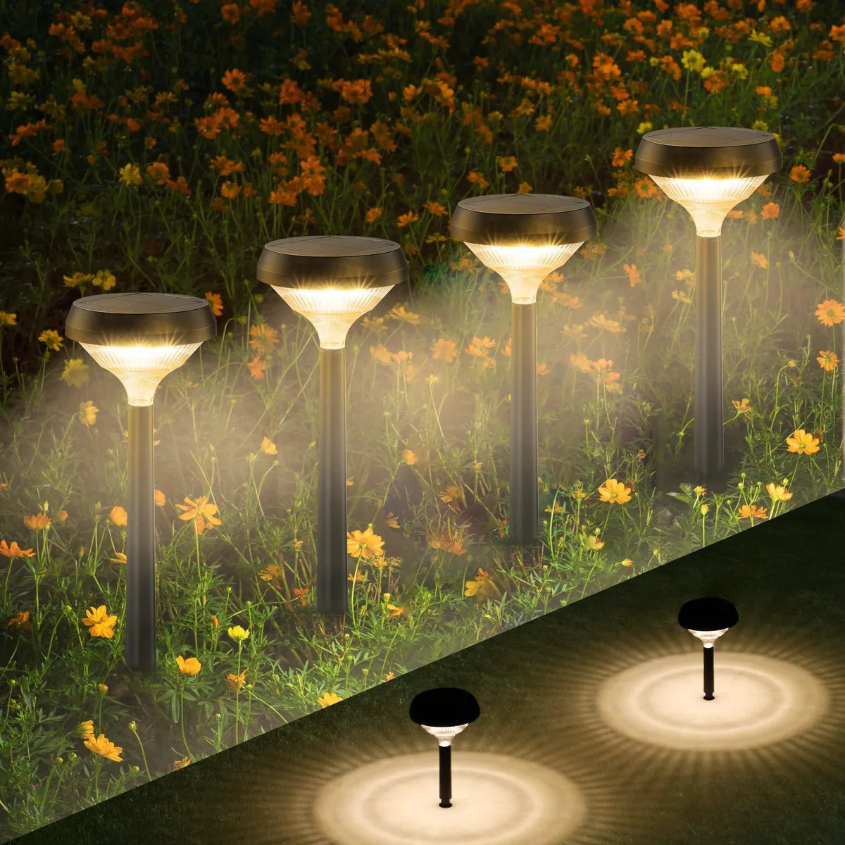Eight black resin solar path lights with acrylic shades on stakes, warm white LEDs, contemporary planet-like design