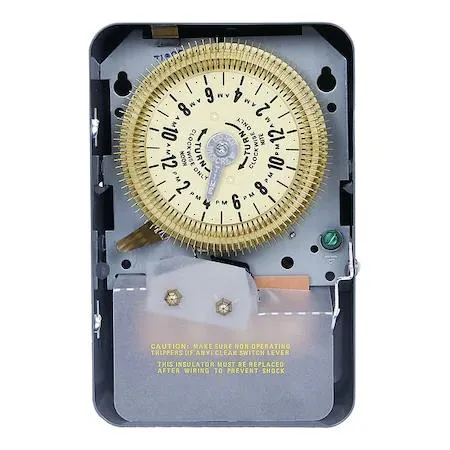 Grey metal box with a 24-hour dial and trippers