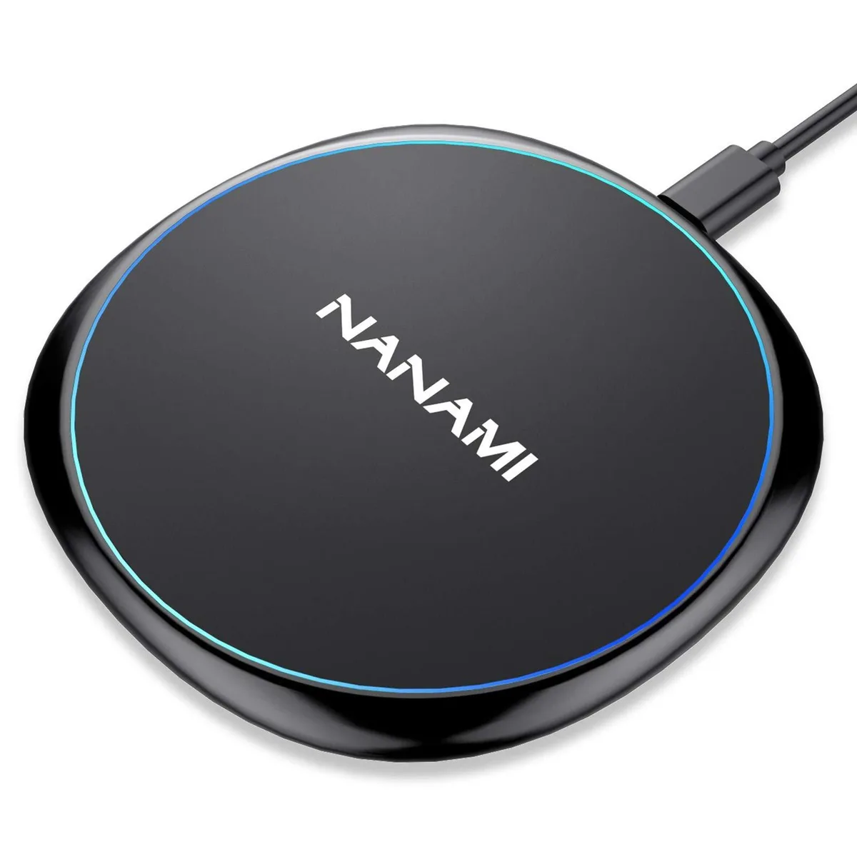 Black circular wireless charging pad with non-slip rubber surface and USB port