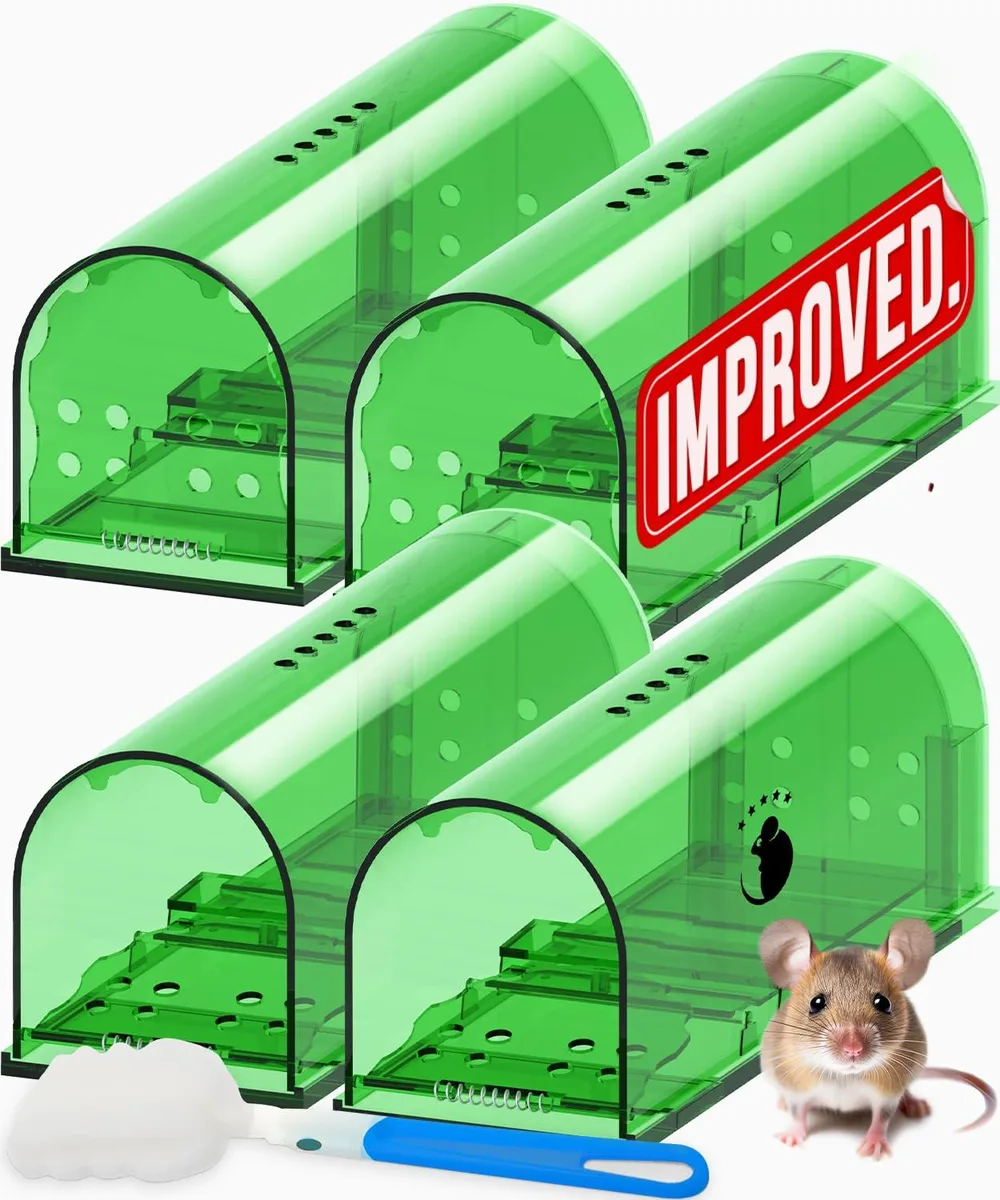Four green plastic humane mouse traps with cleaning brush