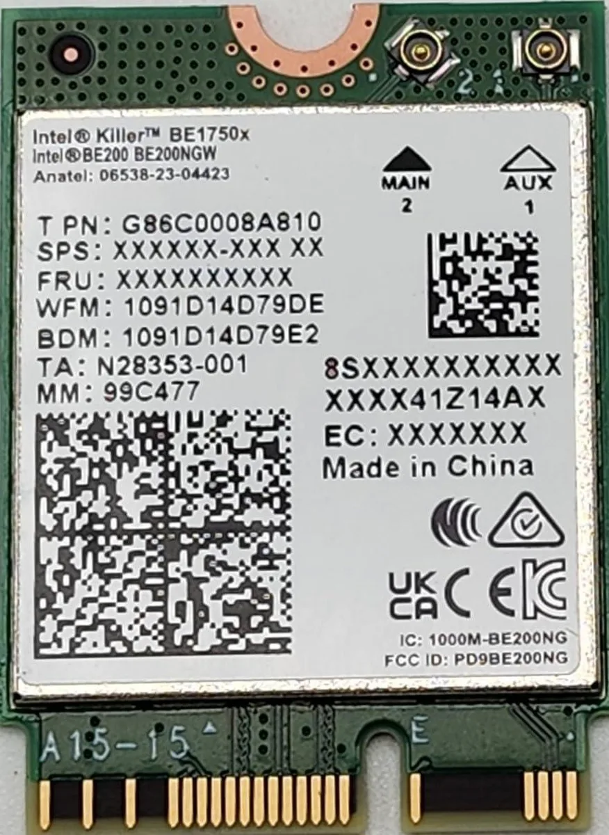 Small green circuit board with gold edge connector and two antenna connectors