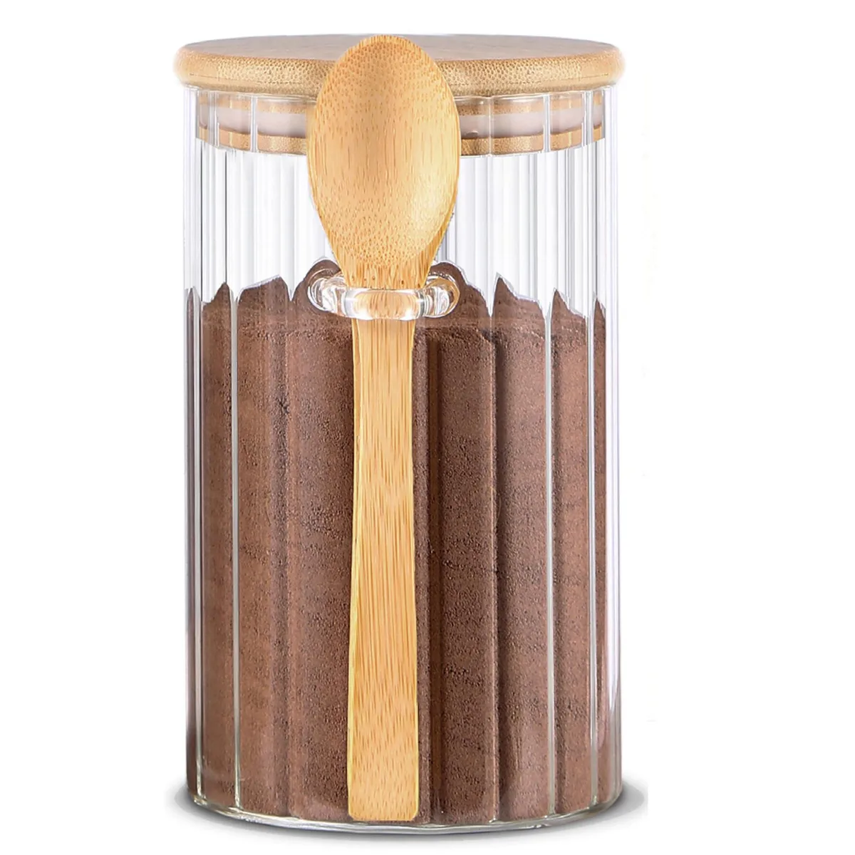 Clear glass jar with vertical ridges, bamboo lid, and wooden spoon inserted in side slot