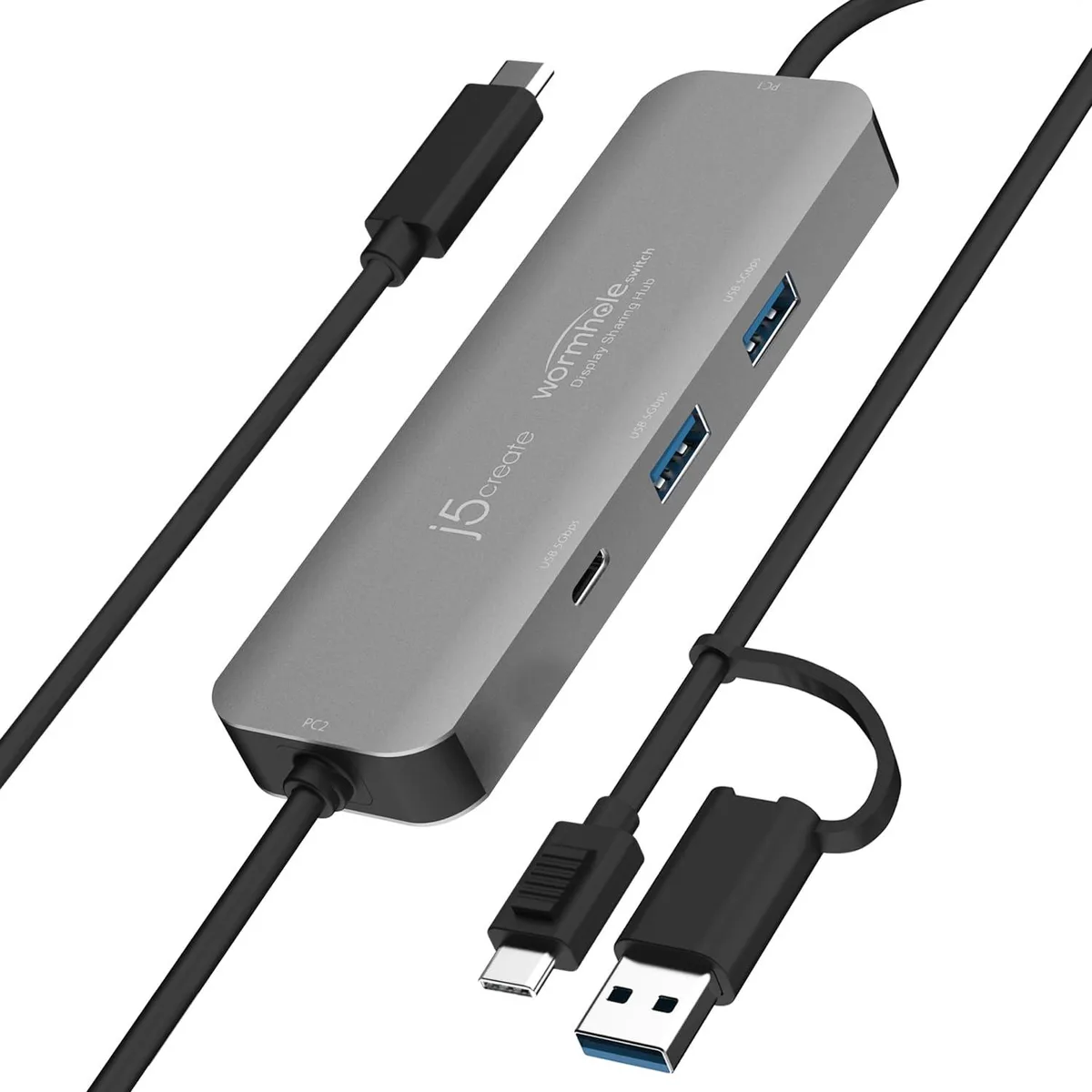 Compact dark docking station with multiple USB ports and cables