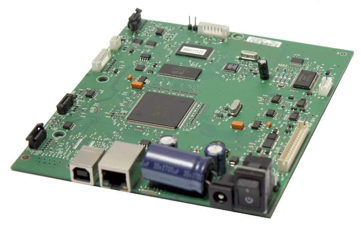 Green rectangular circuit board with black connectors and silver components