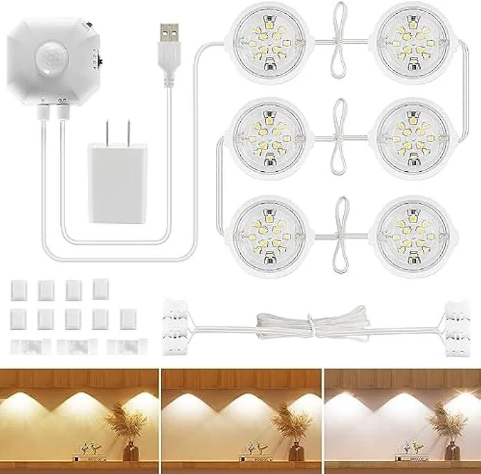 Six small round puck lights on a USB-powered strip with adhesive backing