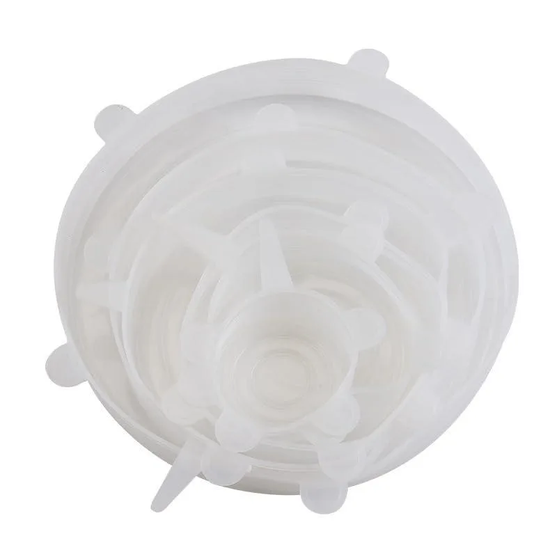 Six white silicone stretch lids in various sizes