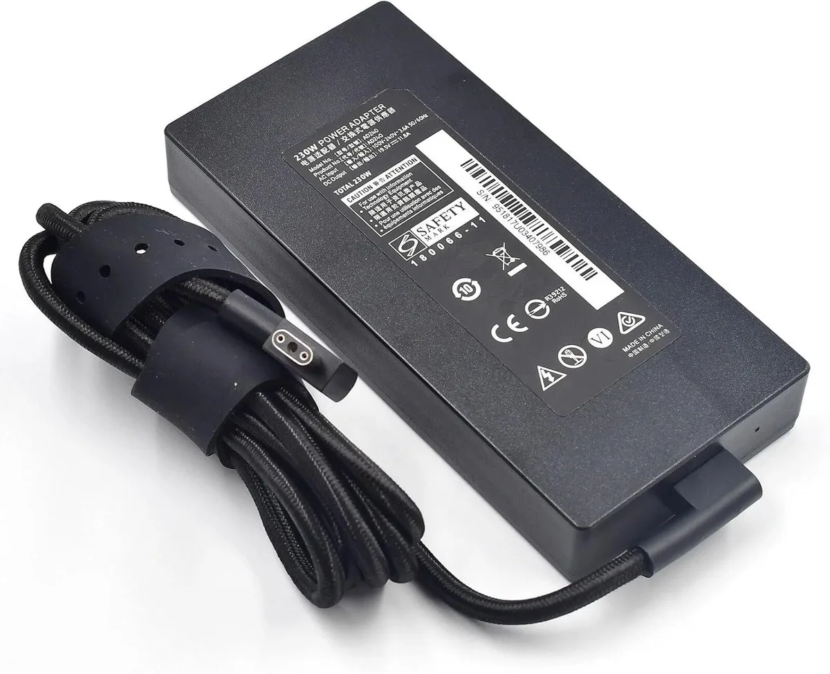 Black rectangular 230W laptop charger with three-pin round connector and detachable power cord