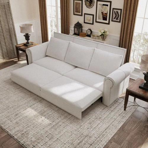 Large beige and white velvet sofa bed with rolled arms and nailhead trim