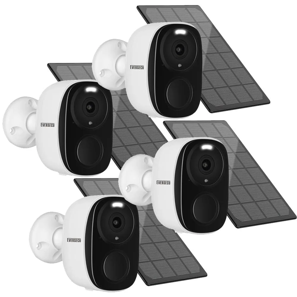 Four white bullet cameras with solar panels and spotlight lenses arranged on a flat surface