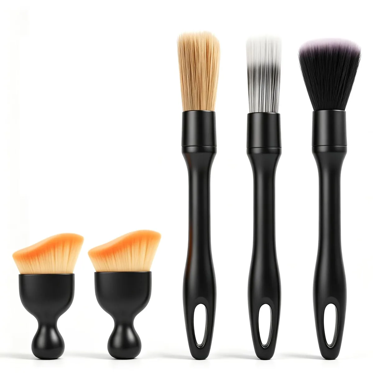 Five car detailing brushes in black and grey finishes