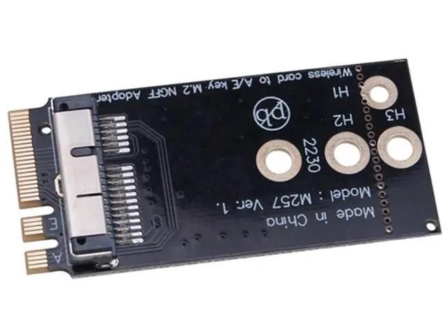Small green circuit board with gold connectors and black chips