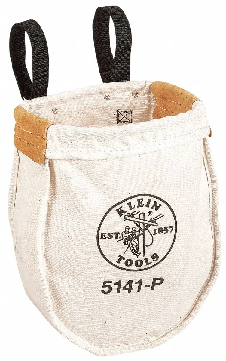 Tan canvas tool bag with leather bottom and metal snaps