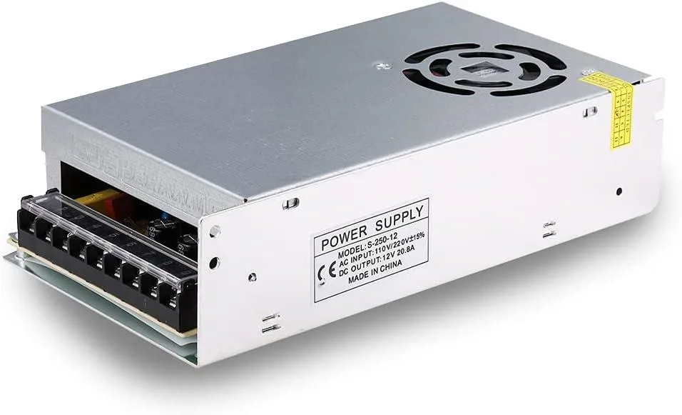 Metal cased switching power supply with ventilation holes and voltage selector switch
