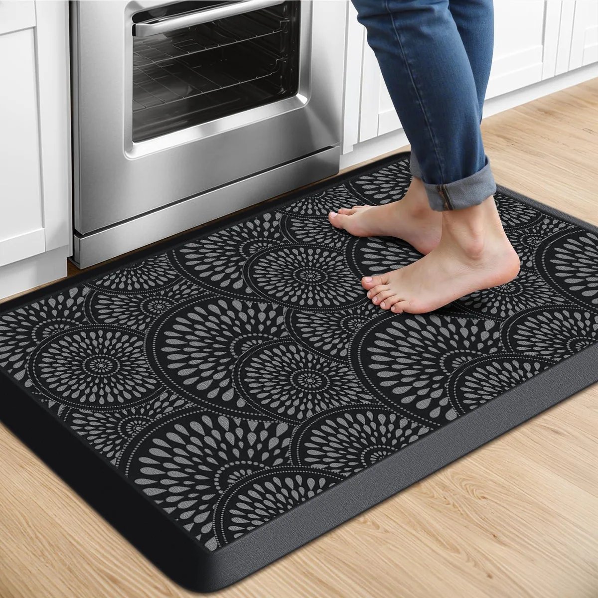 Black rectangular kitchen mat with floral pattern, low profile visco elastic memory foam construction