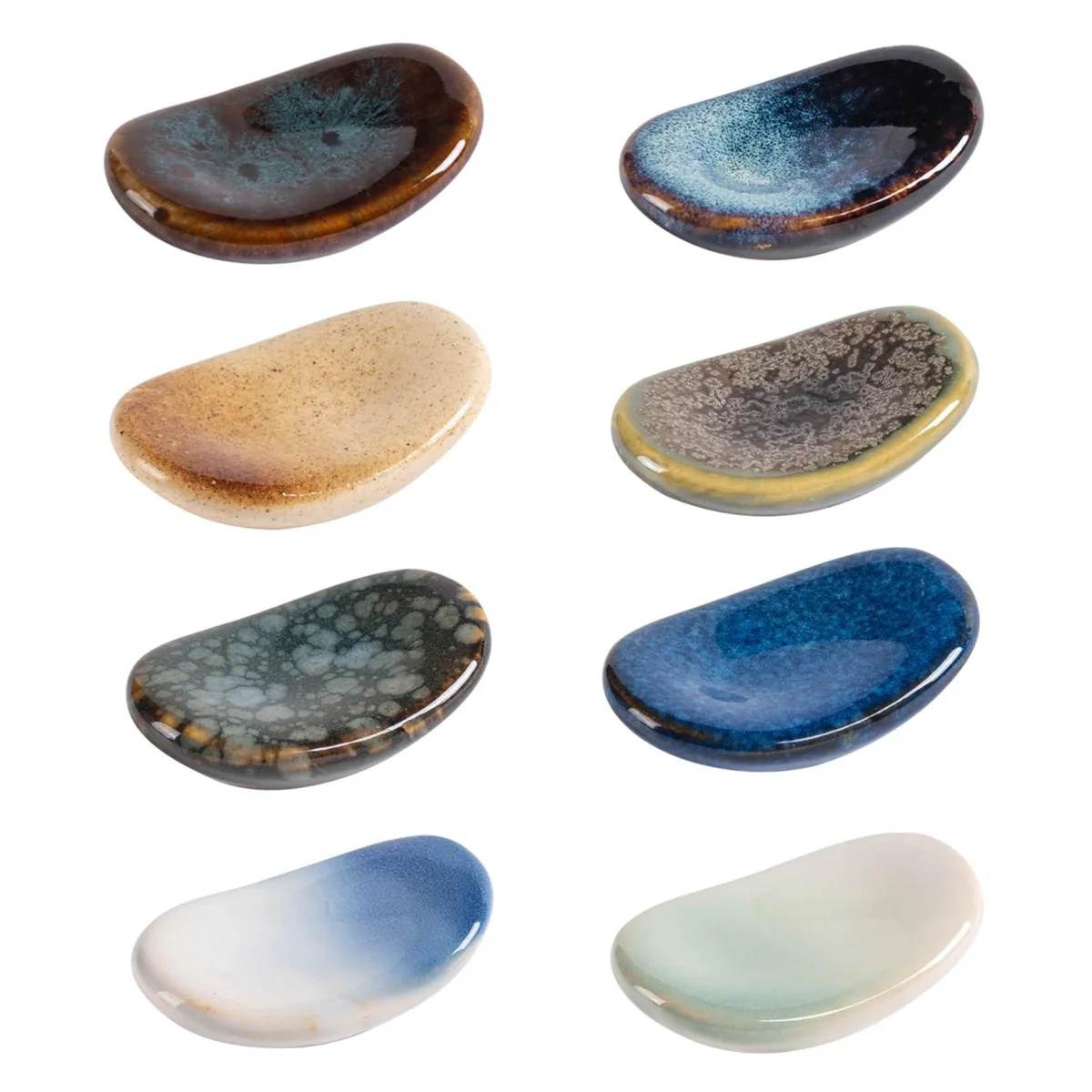 Eight small ceramic chopstick rests in varied glazed colours, each 2.2 by 1.4 by .55 inches