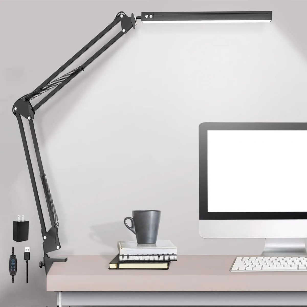 Clip-on LED desk lamp with adjustable swing arm and metal clamp, matte finish