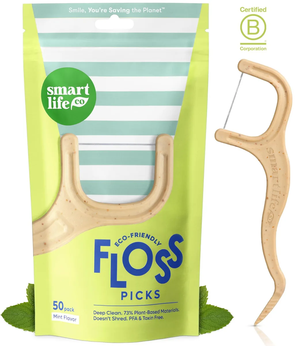 White rectangular box holding fifty mint floss picks made from straw wheat and PLA