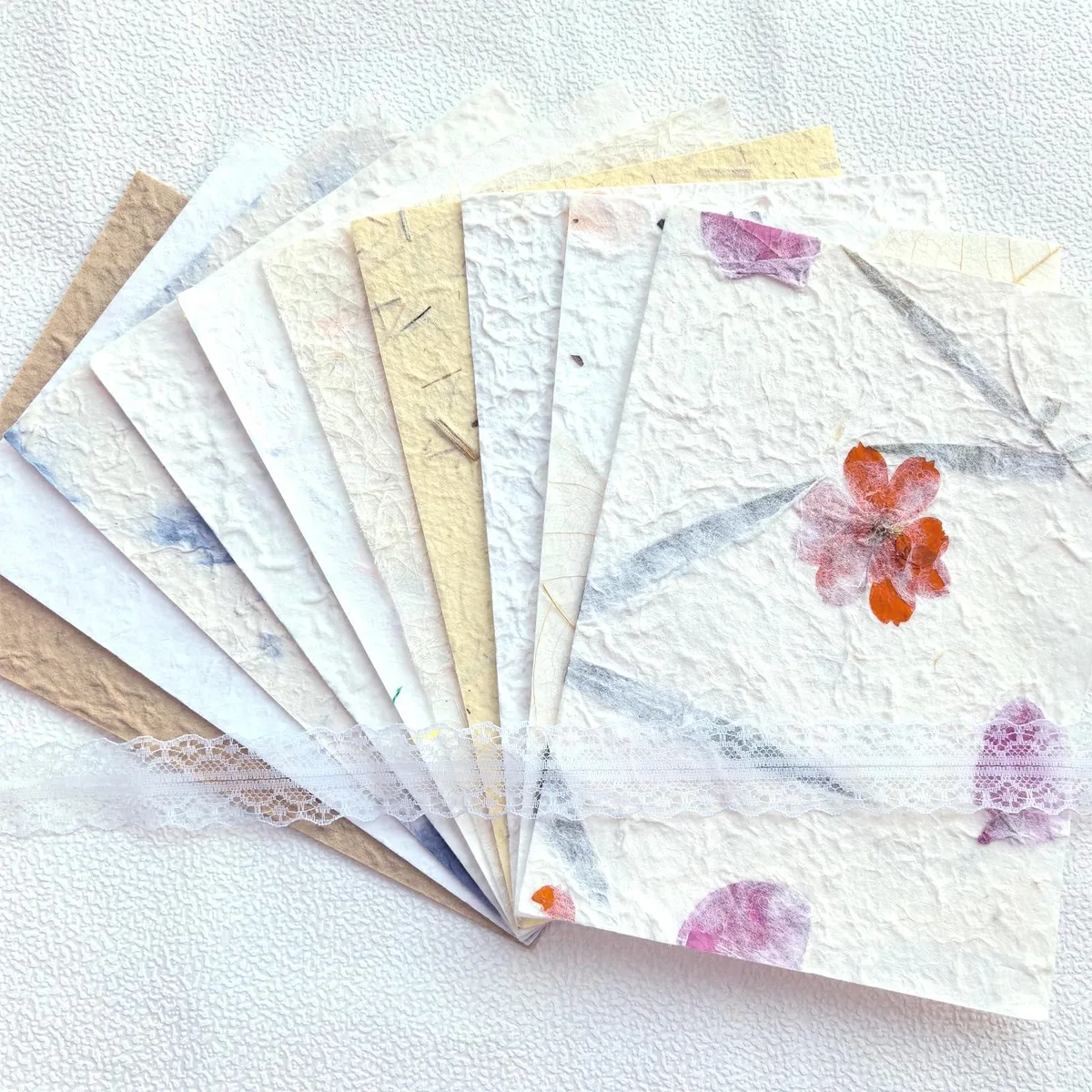 Ten handmade A5 mulberry paper sheets with botanical and embossed textures