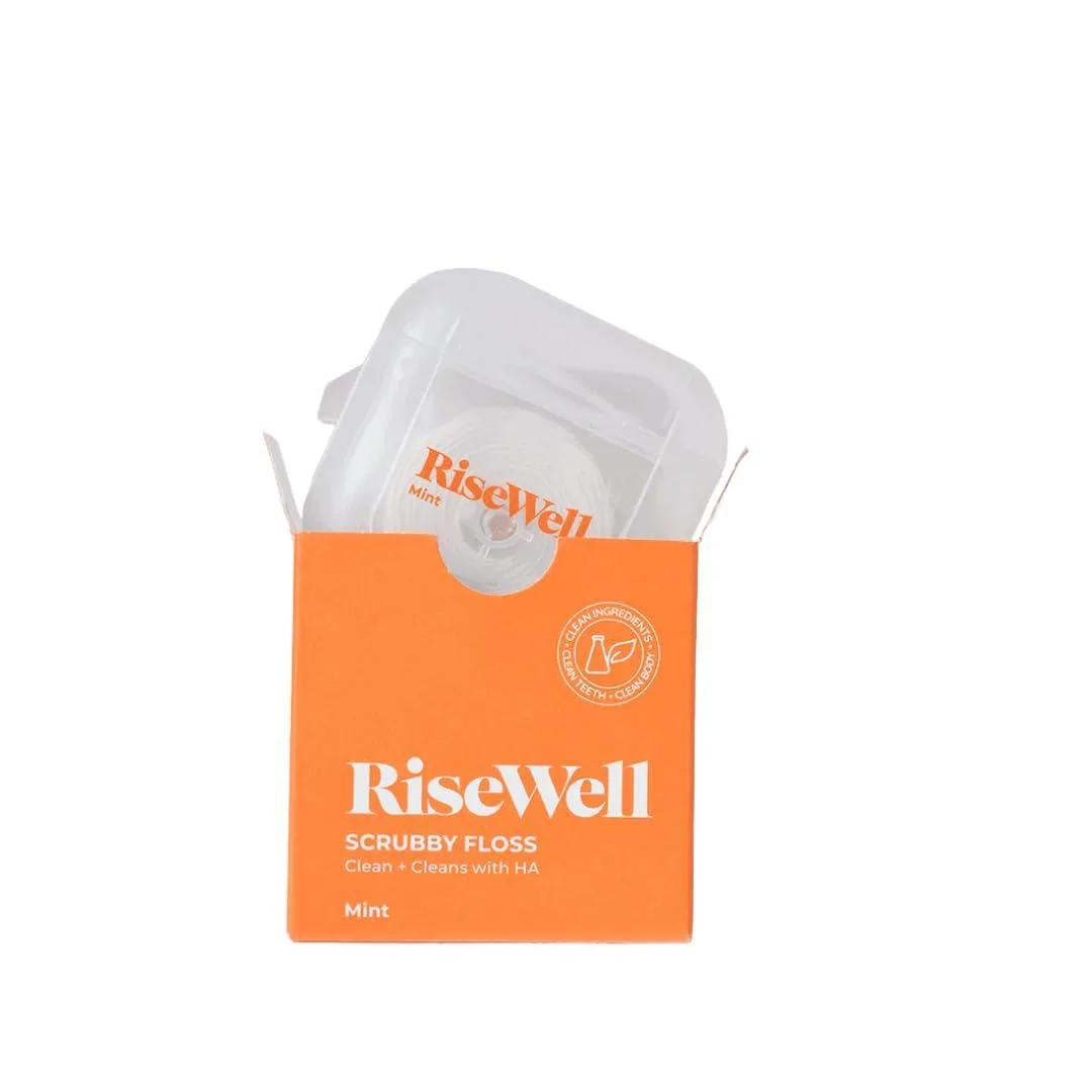 White cylindrical floss dispenser with mint green accents, 90 foot expanding dental floss inside