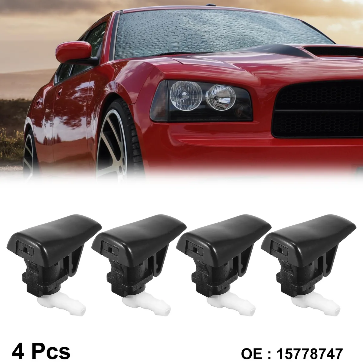 Four small black plastic windshield washer nozzles on a light background
