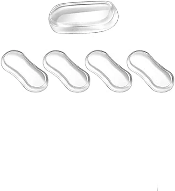 Five clear silicone toilet seat bumpers on adhesive backing