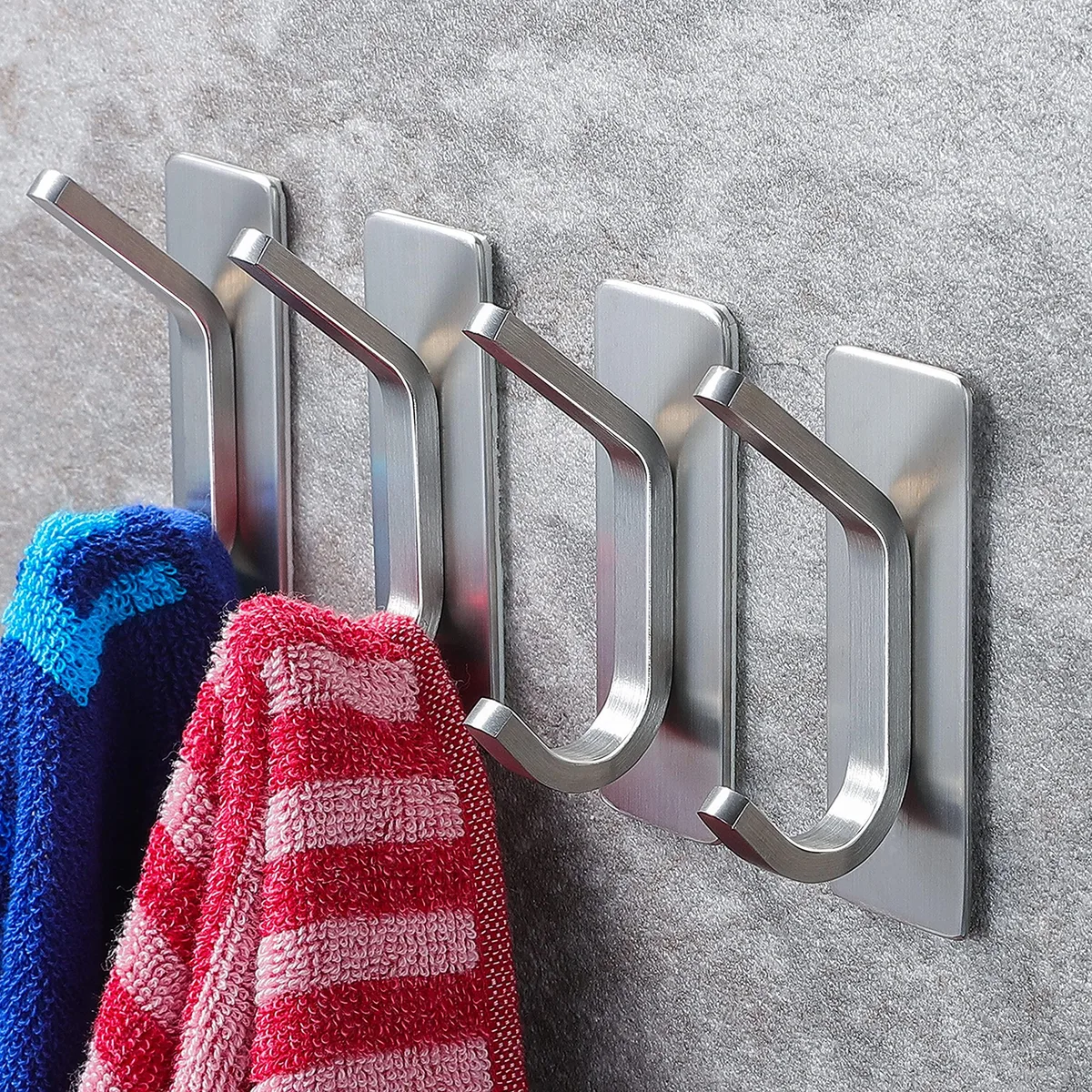 Four brushed stainless steel double hooks with adhesive backing