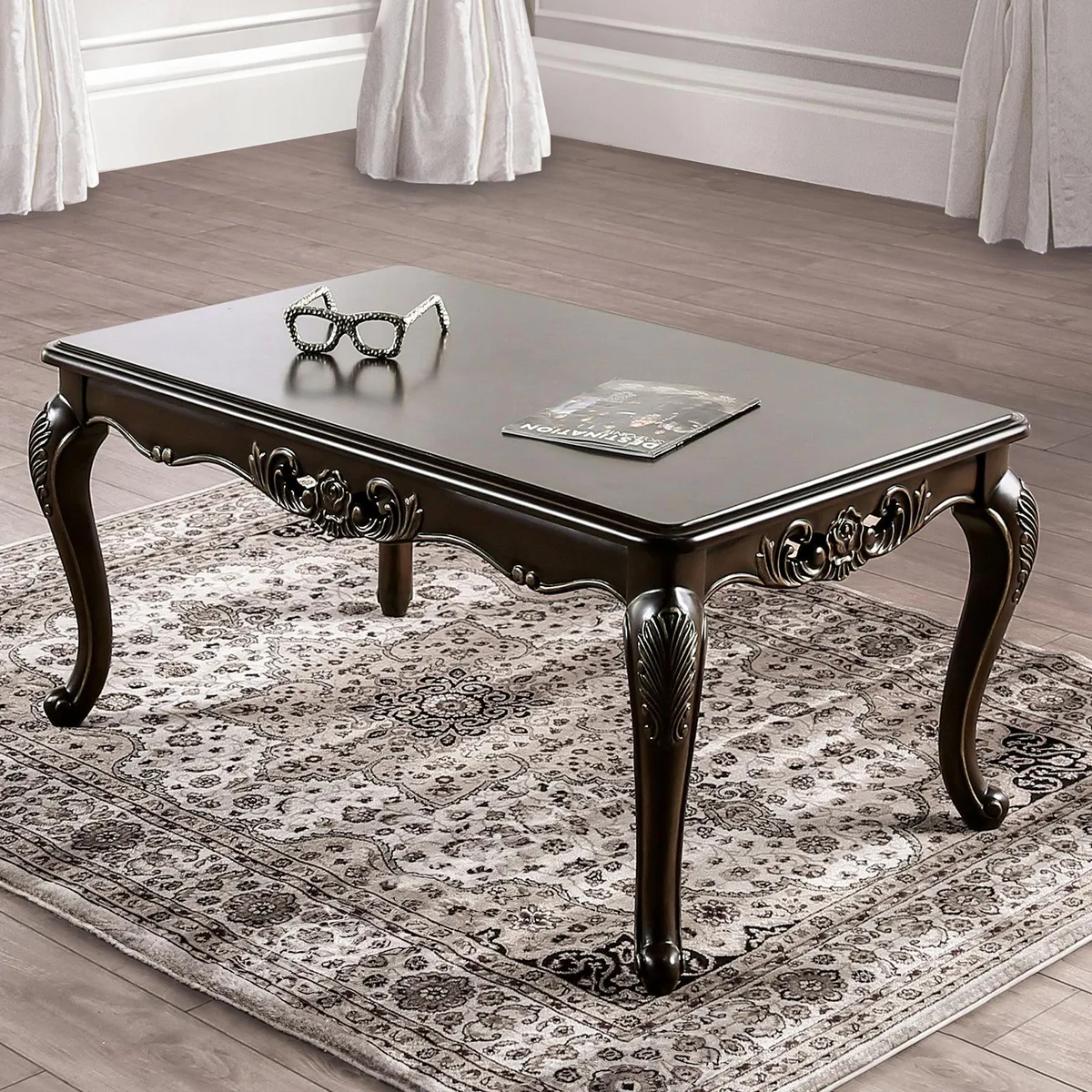 Traditional coffee table with curved cabriole legs and carved details in a java finish