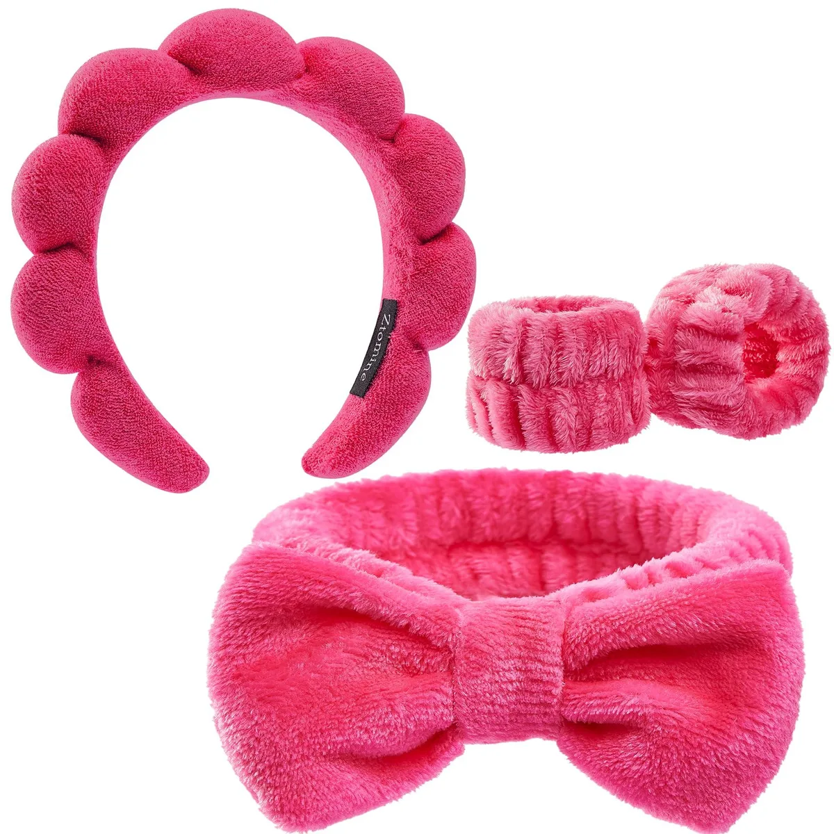 Four-piece spa headband and wristband set in soft fabric, pink and purple colours