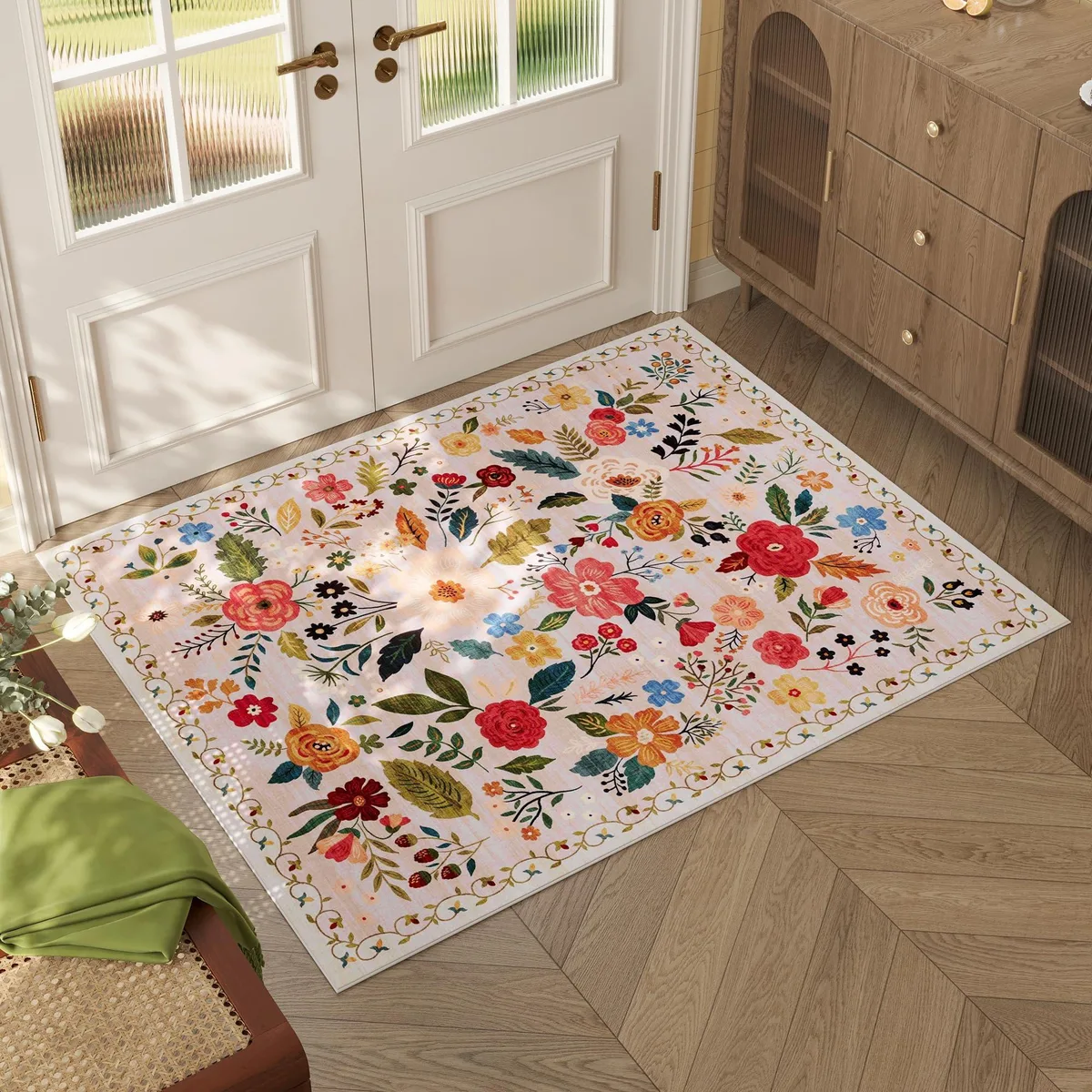 Beige rectangular polyester rug with distressed floral pattern and non-slip backing
