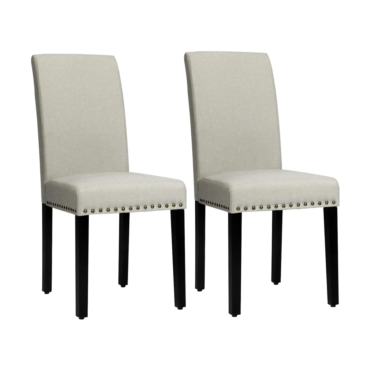 Two light grey fabric dining chairs with nailhead trim and wood legs