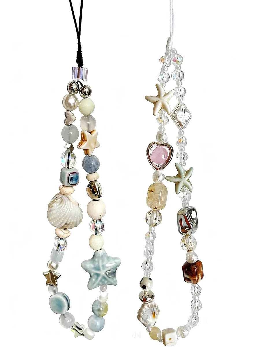 Two white plastic beaded phone charm straps with seashell charms and lobster clasps