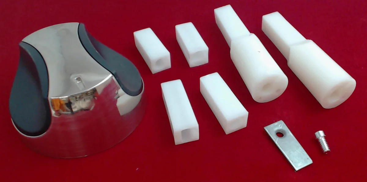 White plastic grill control knob with six interchangeable inserts