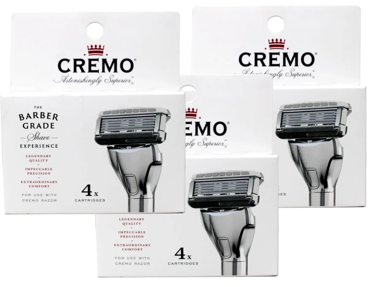 Three packs of four razor refill cartridges in plastic blister packaging