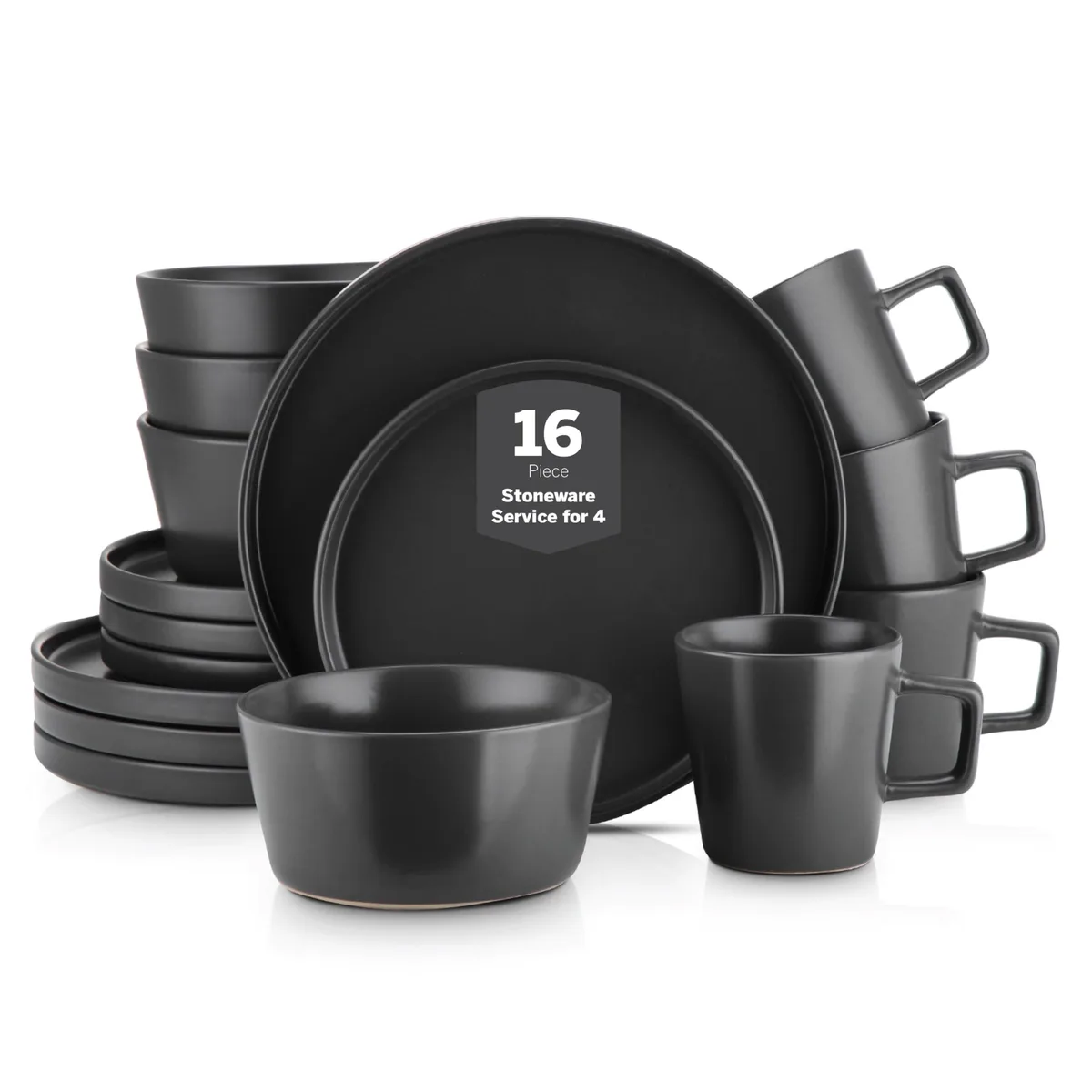 Black matte stoneware dinner set with plates, bowls and mugs on a table