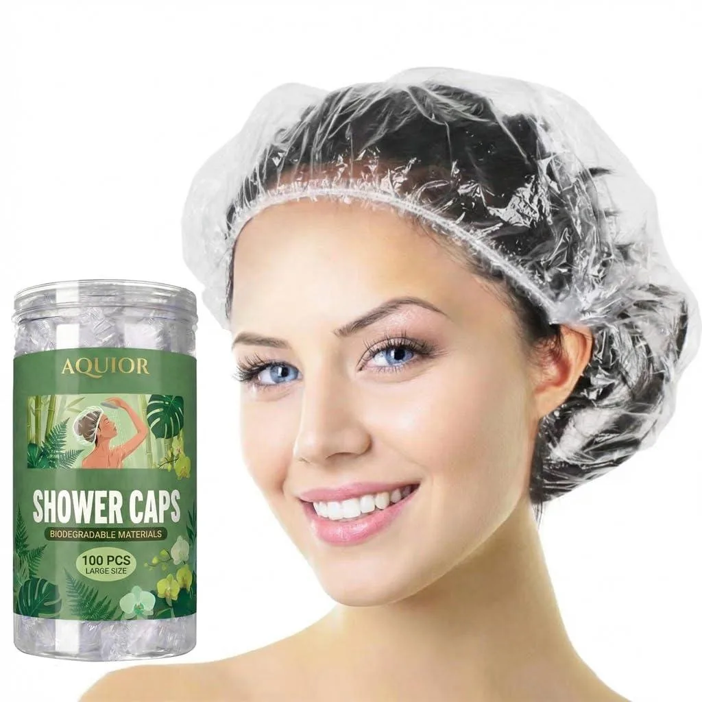 Clear disposable plastic shower caps packed 100 per box