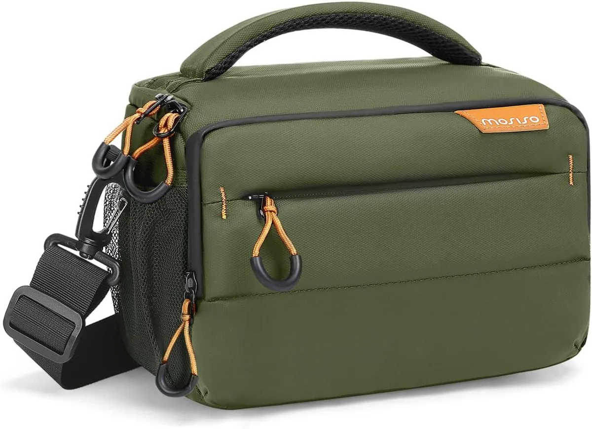 Army green compact camera shoulder bag with crossbody strap and rain cover